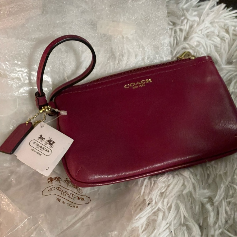 Coach wristlet/wallet in a deep red..